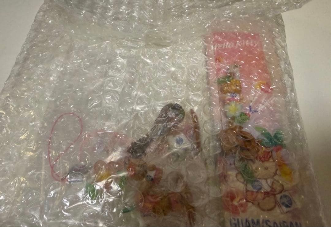 ご当地ハワイグアム日焼けkitty根付けストラップ abcstore