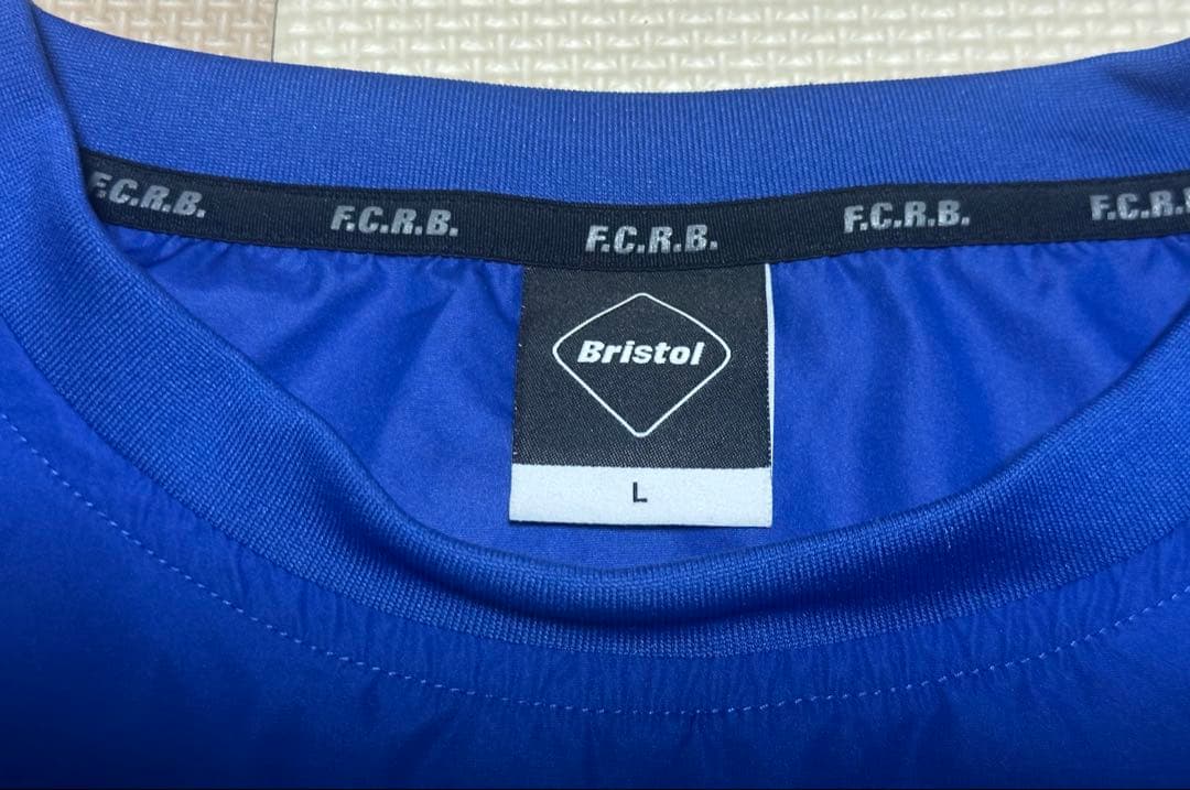 【未使用級】F.C.R.B. ブリストル ブルー ピステ L 背面ロゴ メンズ