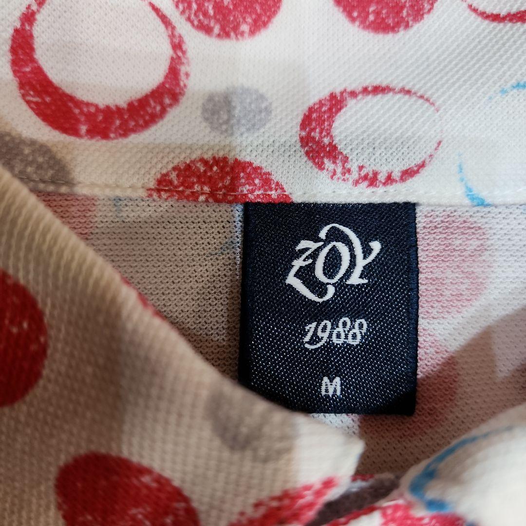 新品未使用:ZOY:ゾーイの白地に赤、グレー、水色のポロシャツ