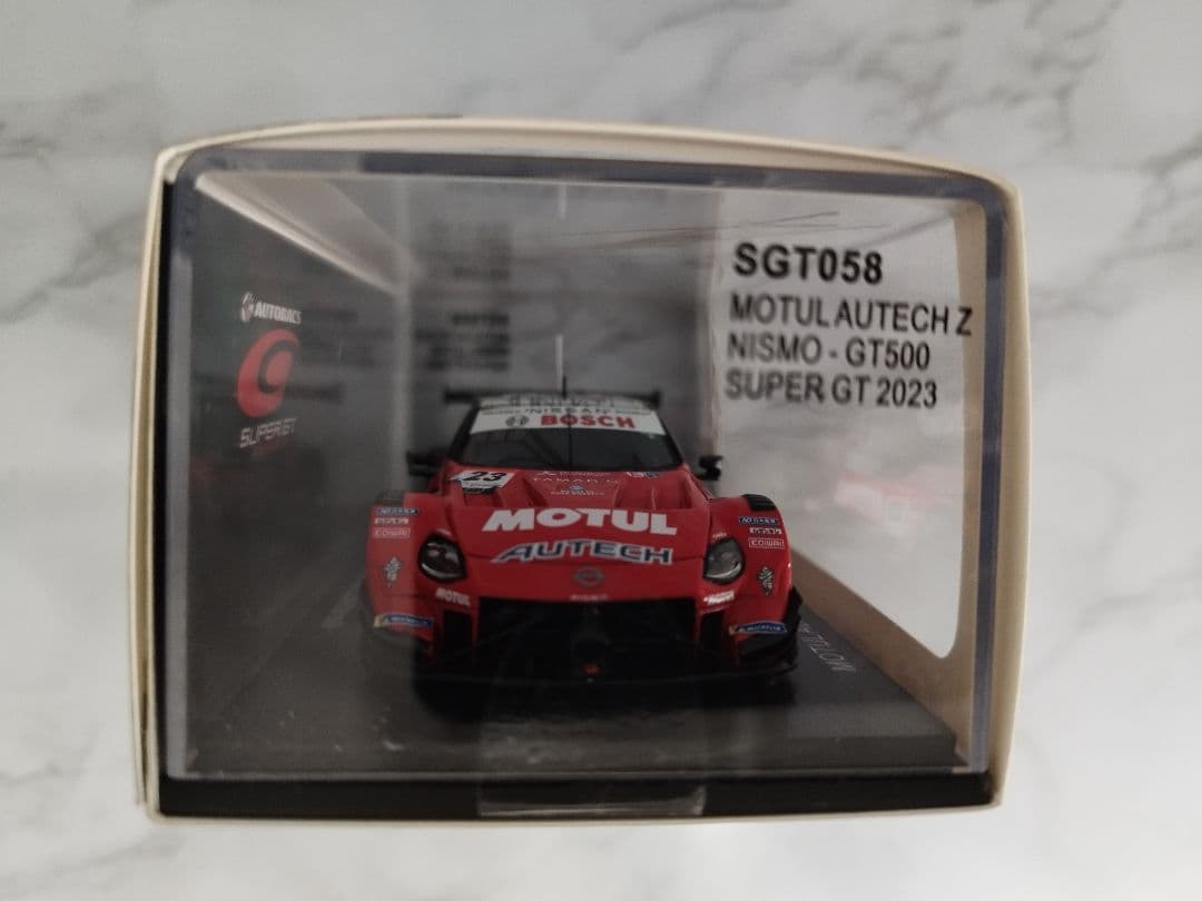 プロレーサーの松田次生選手の生サイン入り1/43スケールミニカー