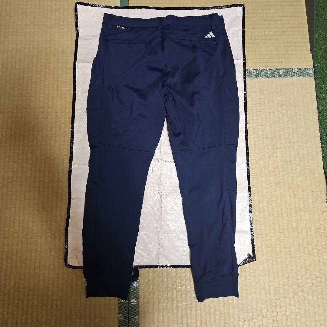 adidas オレンジポロシャツとストレッチ保温ジョガーパンツ、帽子セット 売り