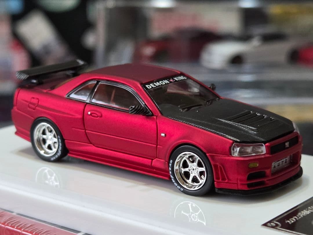 限定700台1/64車魔王AUTOEXPO2025日産スカイラインGT-R34赤