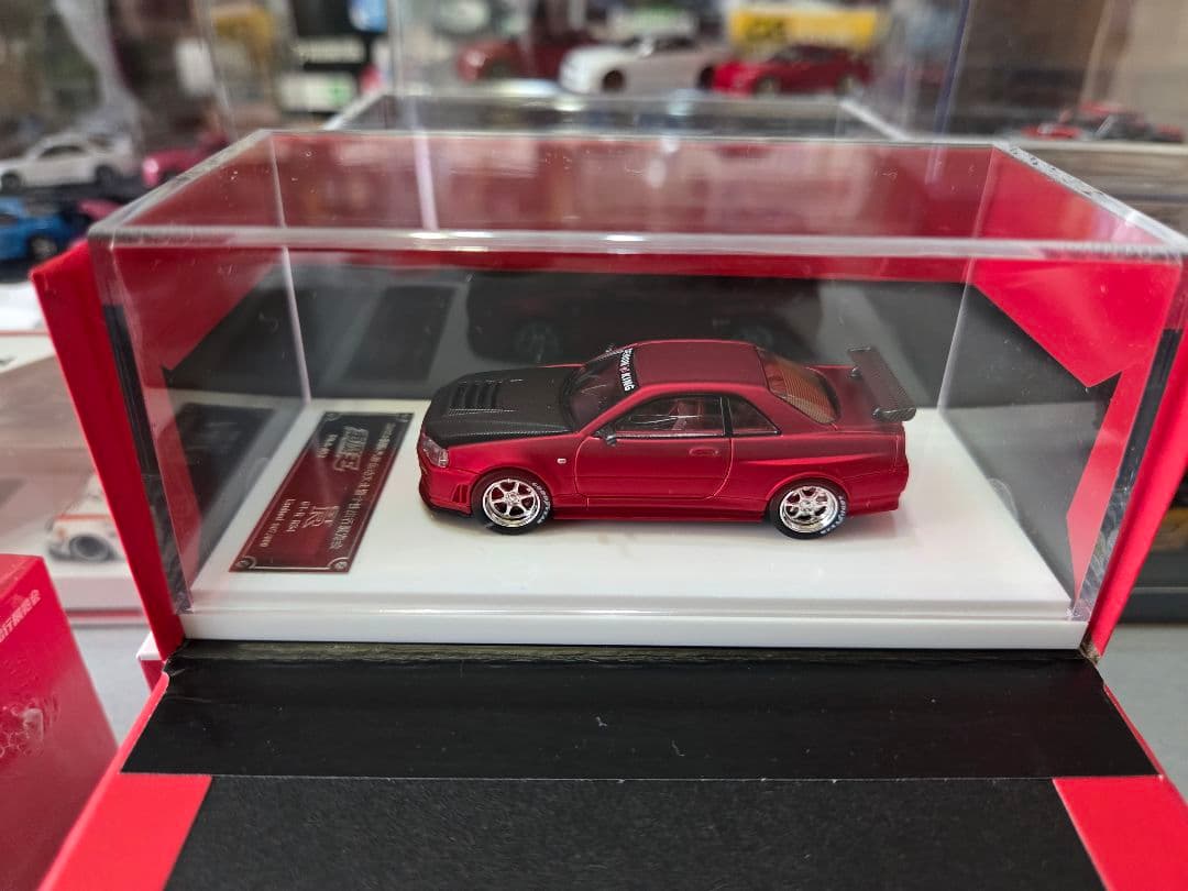 限定700台1/64車魔王AUTOEXPO2025日産スカイラインGT-R34赤