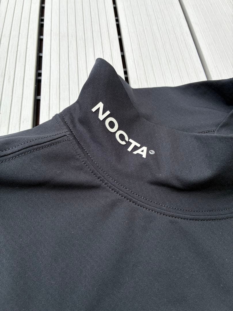【中古】NOCTA NIKE モックネックシャツ ブラック Sサイズ