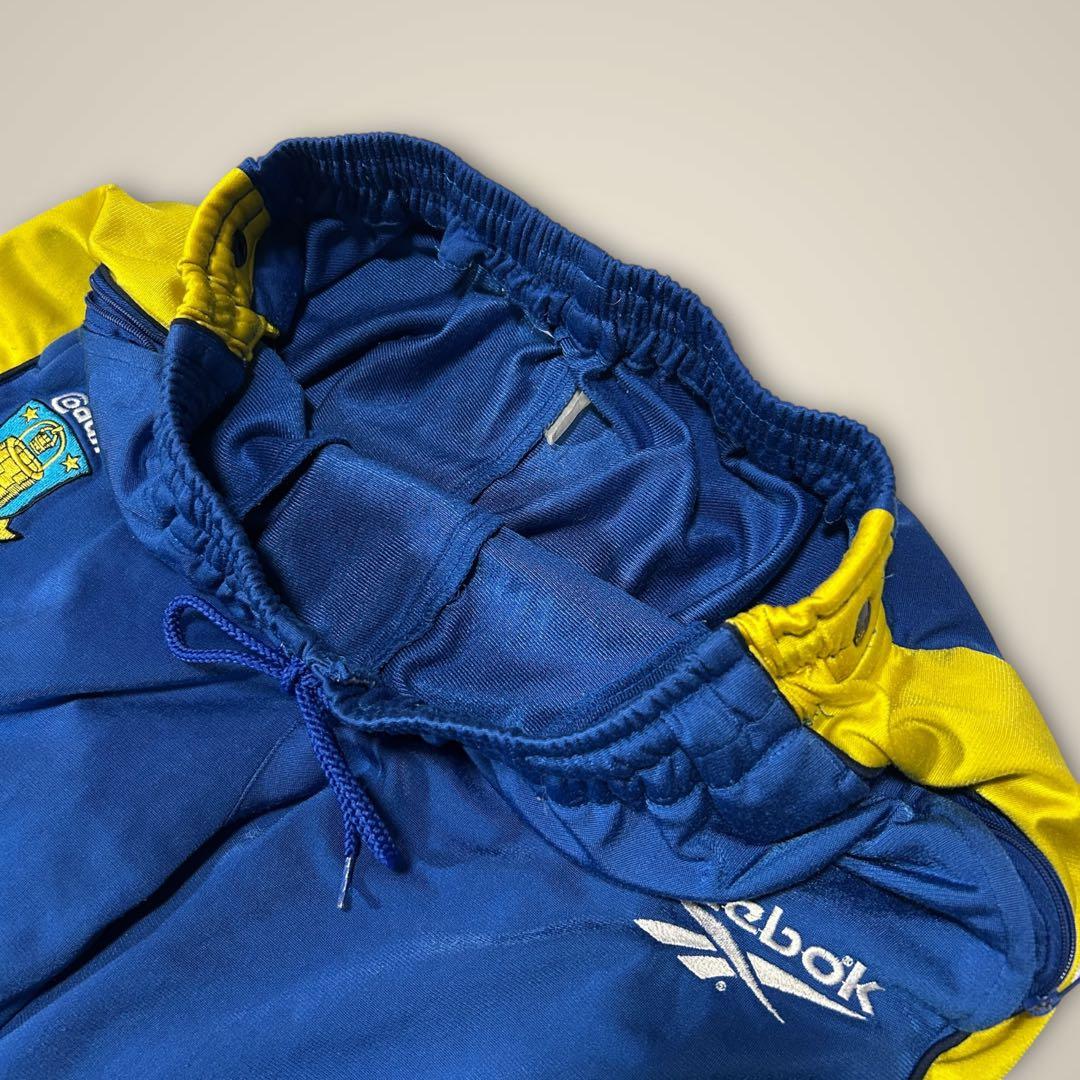 リーボック ReebokトラックパンツサイドスナップサッカーブレンビーIF青黄
