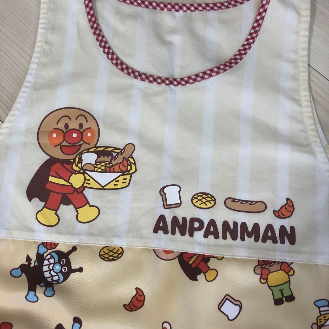 アンパンマン エプロン クリーム色　パンをおととどけ　フレーベル館