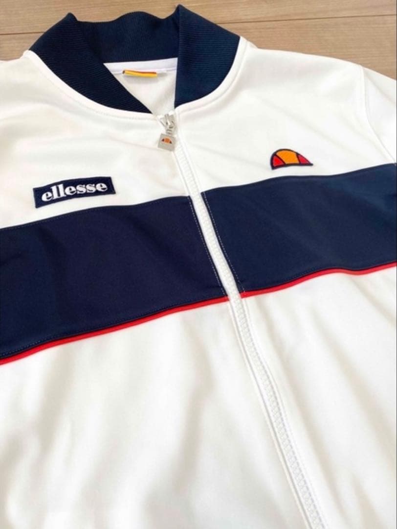 春にピッタリellesse ジップアップ ホワイト/ネイビー　Ｌ
