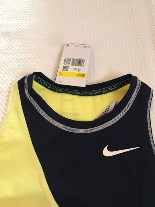 NIKE ナイキ テニスウェア　黒、黄色トップス　US-Sサイズ　新品