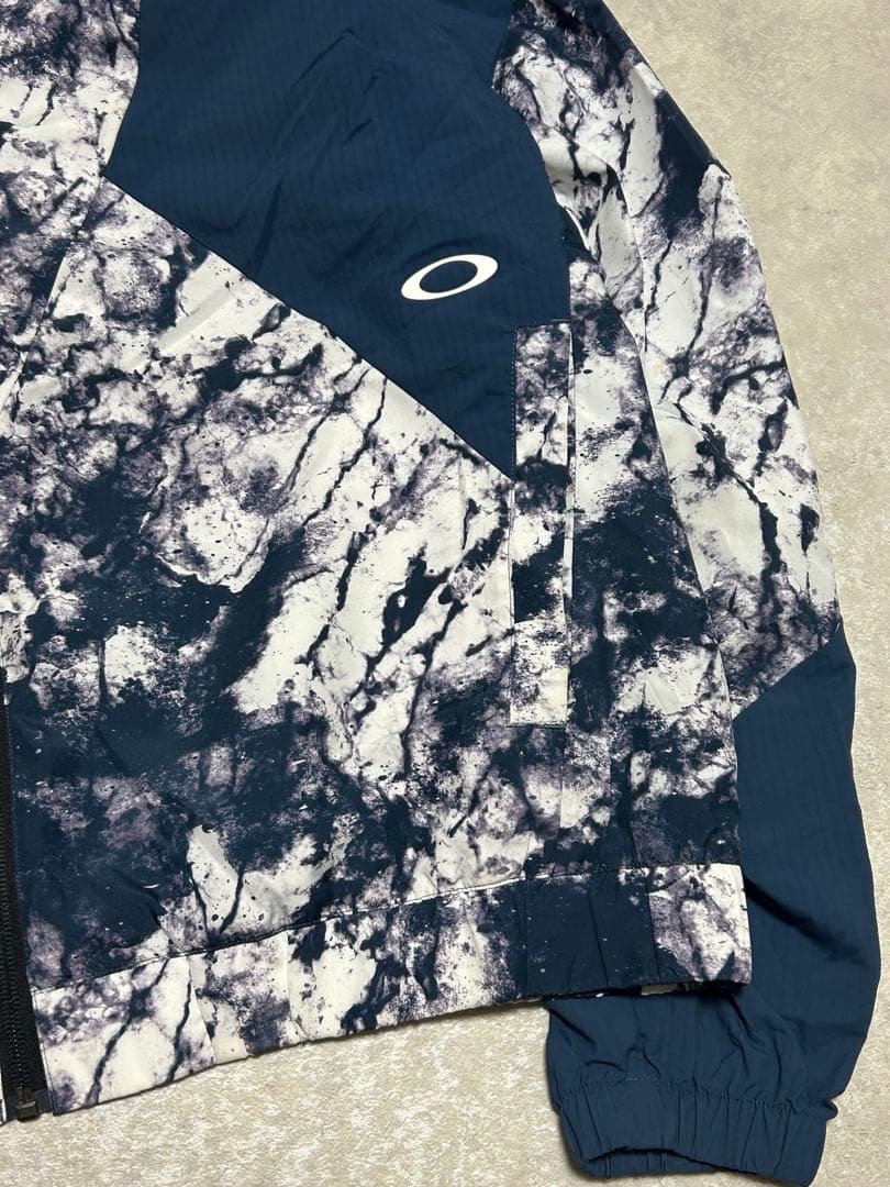 極美品 OAKLEY ENHANCE GRAPHIC WIND L 総柄 メンズ