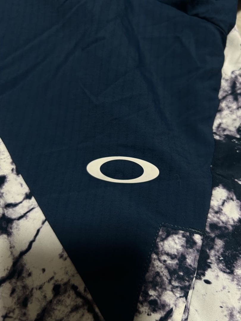 極美品 OAKLEY ENHANCE GRAPHIC WIND L 総柄 メンズ