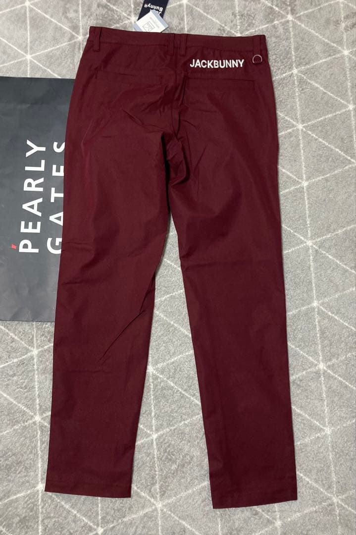 新品 パーリーゲイツ ジャックバニー ポリエステルツイル パンツ(4)M/ワイン