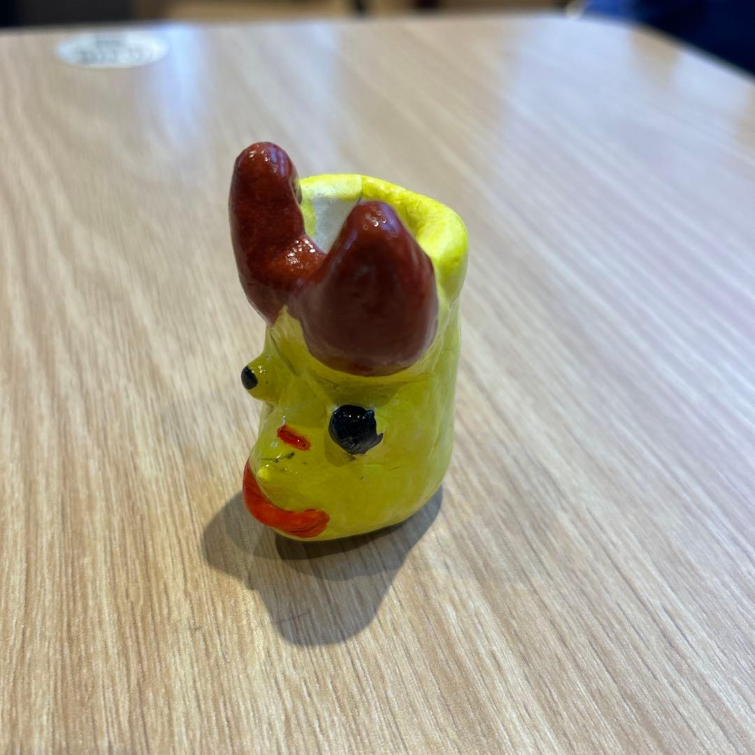 黄色の顔型小物入れ