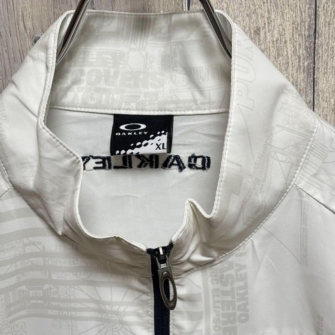 オークリー　OAKLEY ジャケット　ナイロン　総柄　刺繍ロゴ　ホワイト XL
