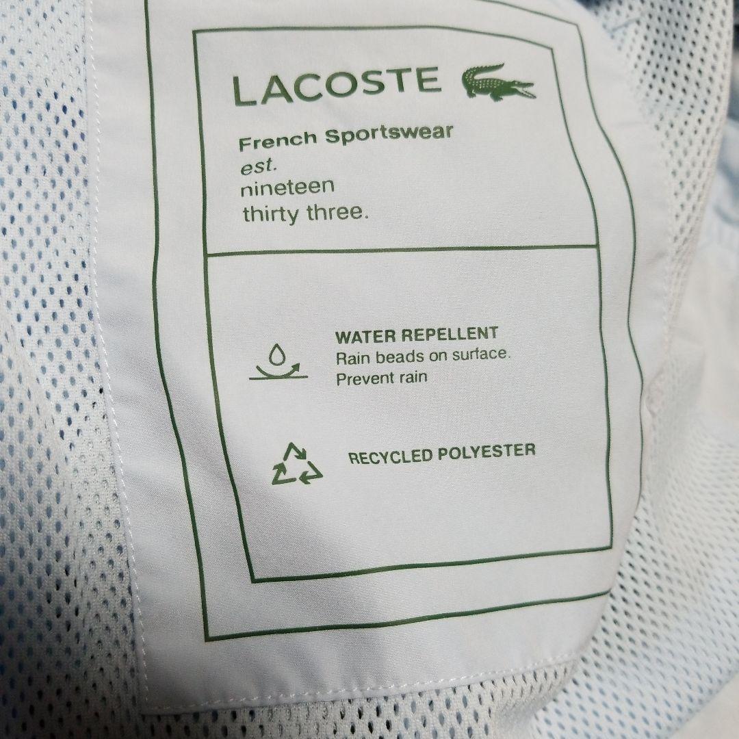 新品未使用。正規LACOSTEスポーツウインドブレーカー「フード付き」