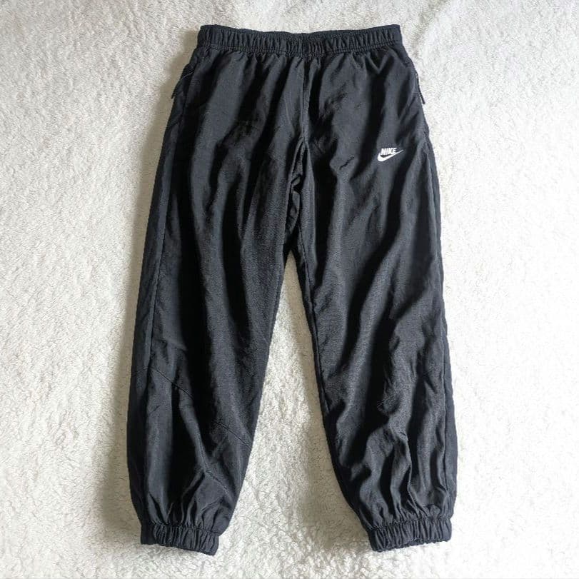 新品 NIKE ナイキ ナイロンウーブンパンツ 裏起毛
