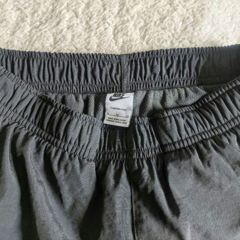 新品 NIKE ナイキ ナイロンウーブンパンツ 裏起毛