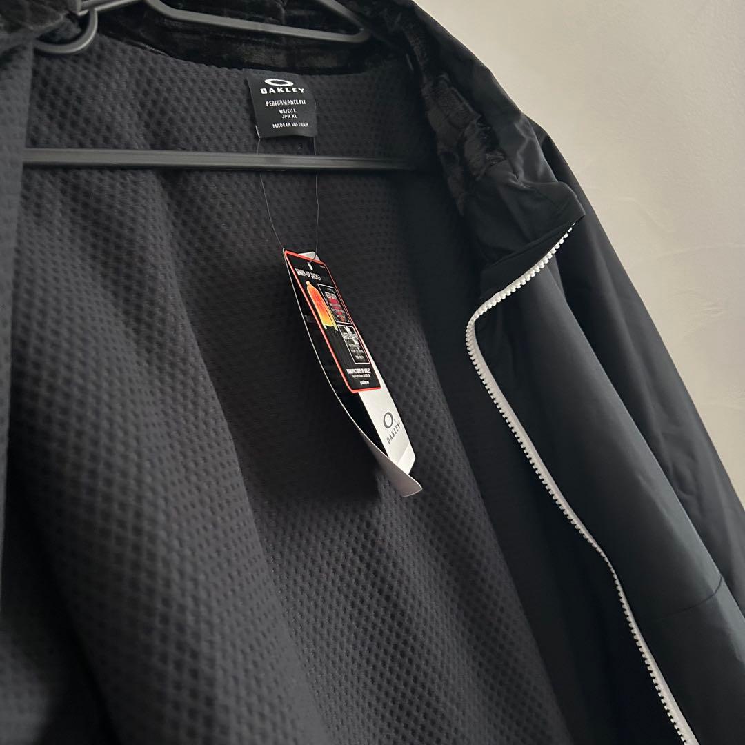新品オークリー ENHANCE WIND WARM STAND JACKET