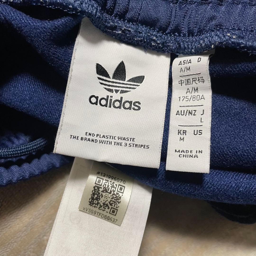 adidasアディカラー バギーフィット ファイヤーバードトラックパンツ