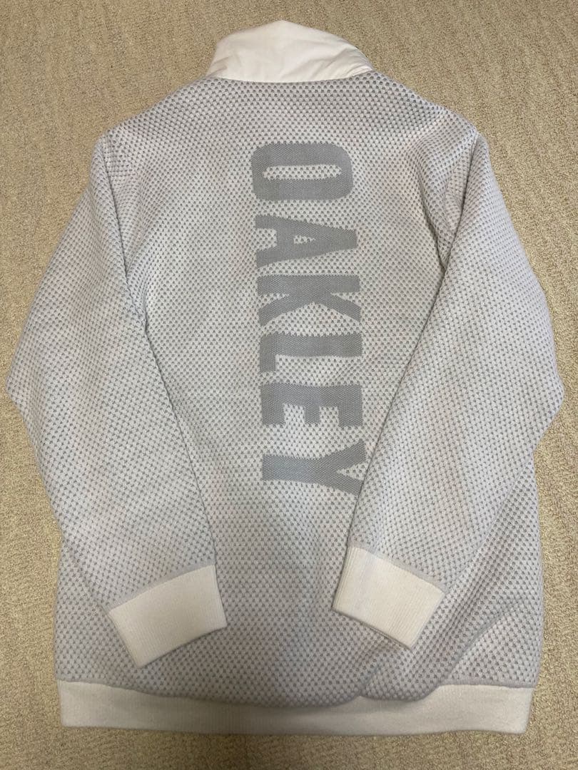 今夜も一休み様Oakley ホワイト ジャケット フルジップ ゴルフ L