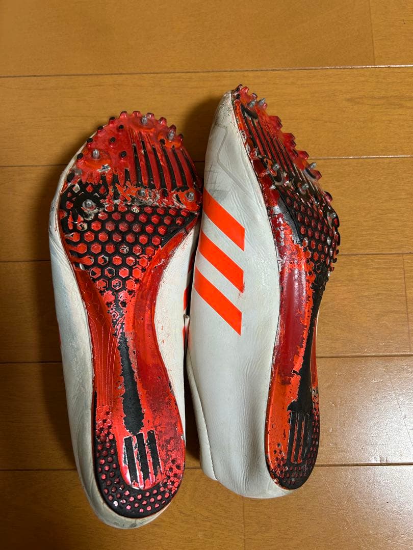 adidas スパイクシューズ ホワイト/オレンジ