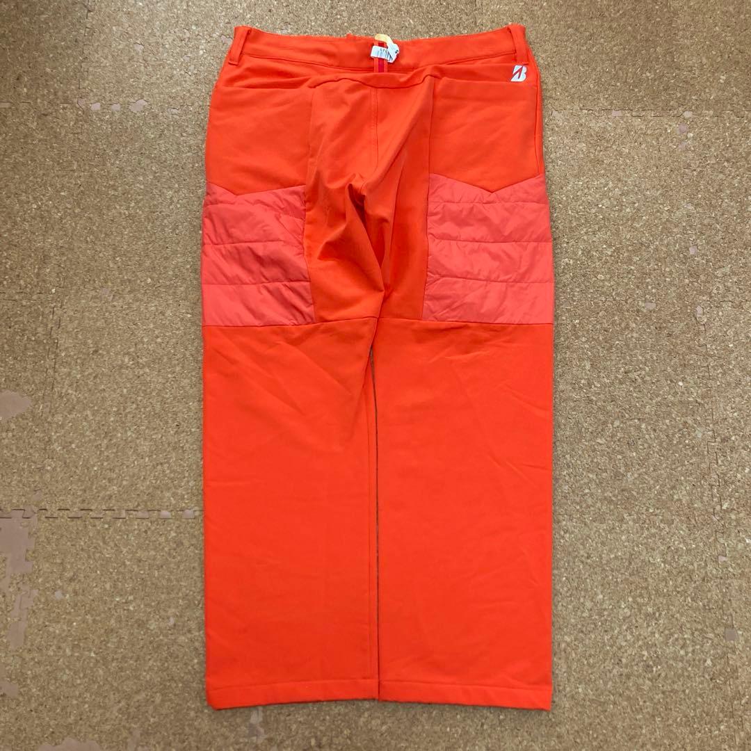 【美品】ブリヂストンTOURBゴルフウェア パンツ88cmメンズオレンジ中綿秋冬