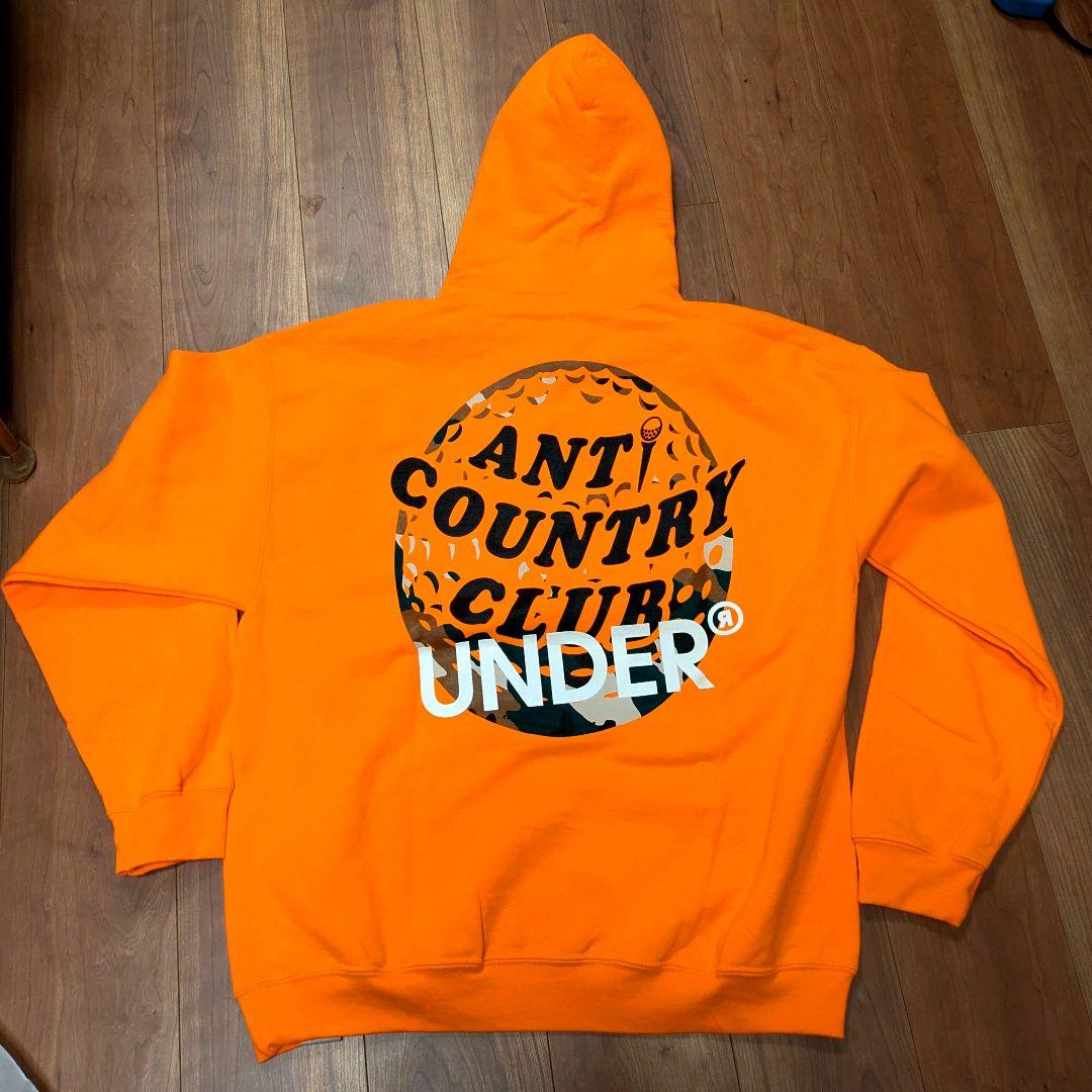 ANTI COUNTRY CLUB ✕ UNDER フーディ オレンジ