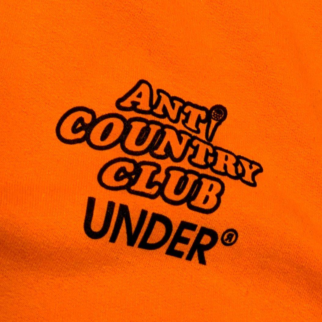 ANTI COUNTRY CLUB ✕ UNDER フーディ オレンジ