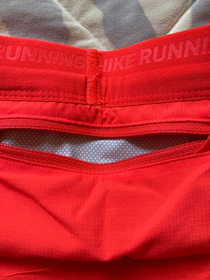 Nike Dri-FIT ストライド ショートパンツ オレンジ
