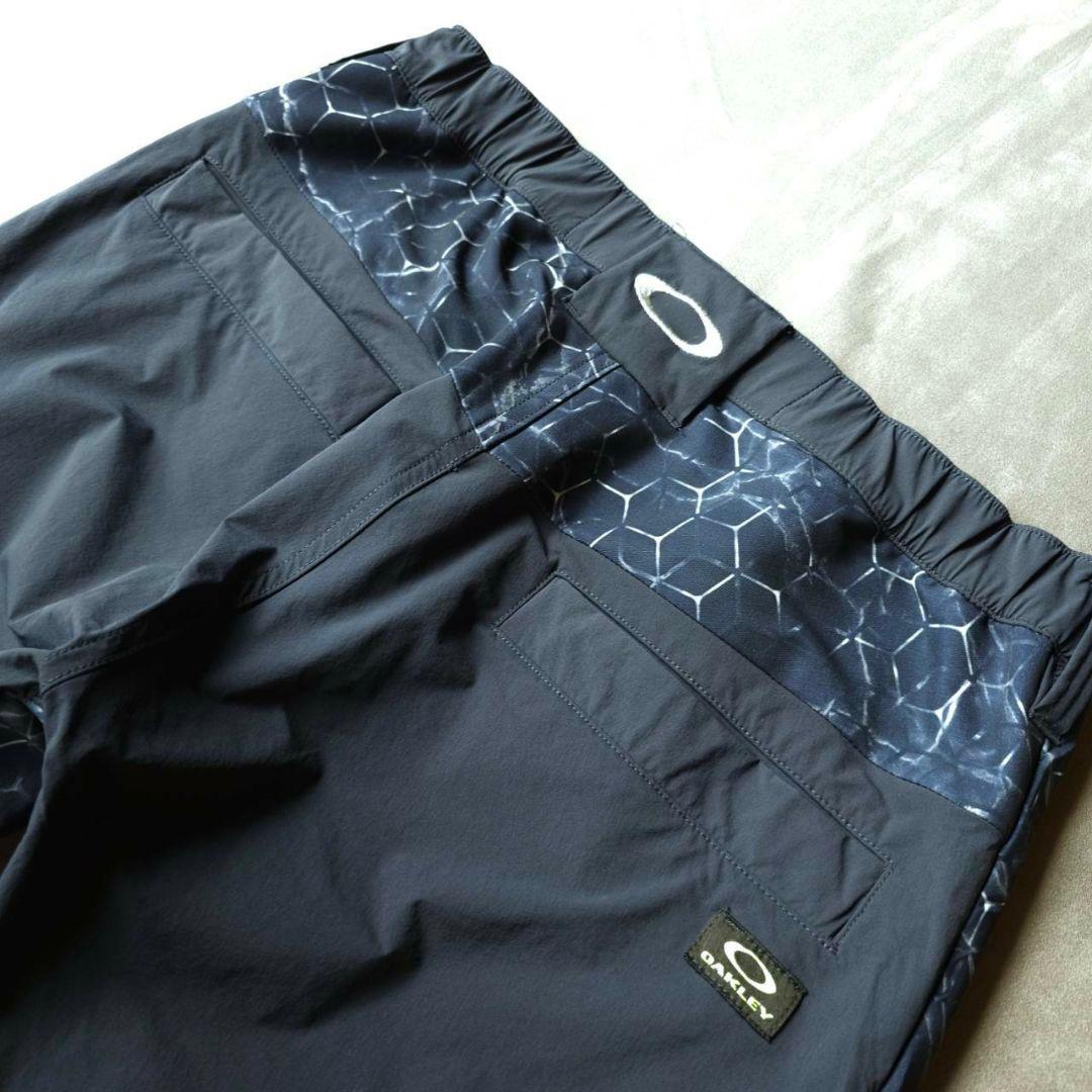 【オークリーゴルフ】蓄熱HEAT×防風 グラフィックデザイン 秋冬ゴルフバンツM