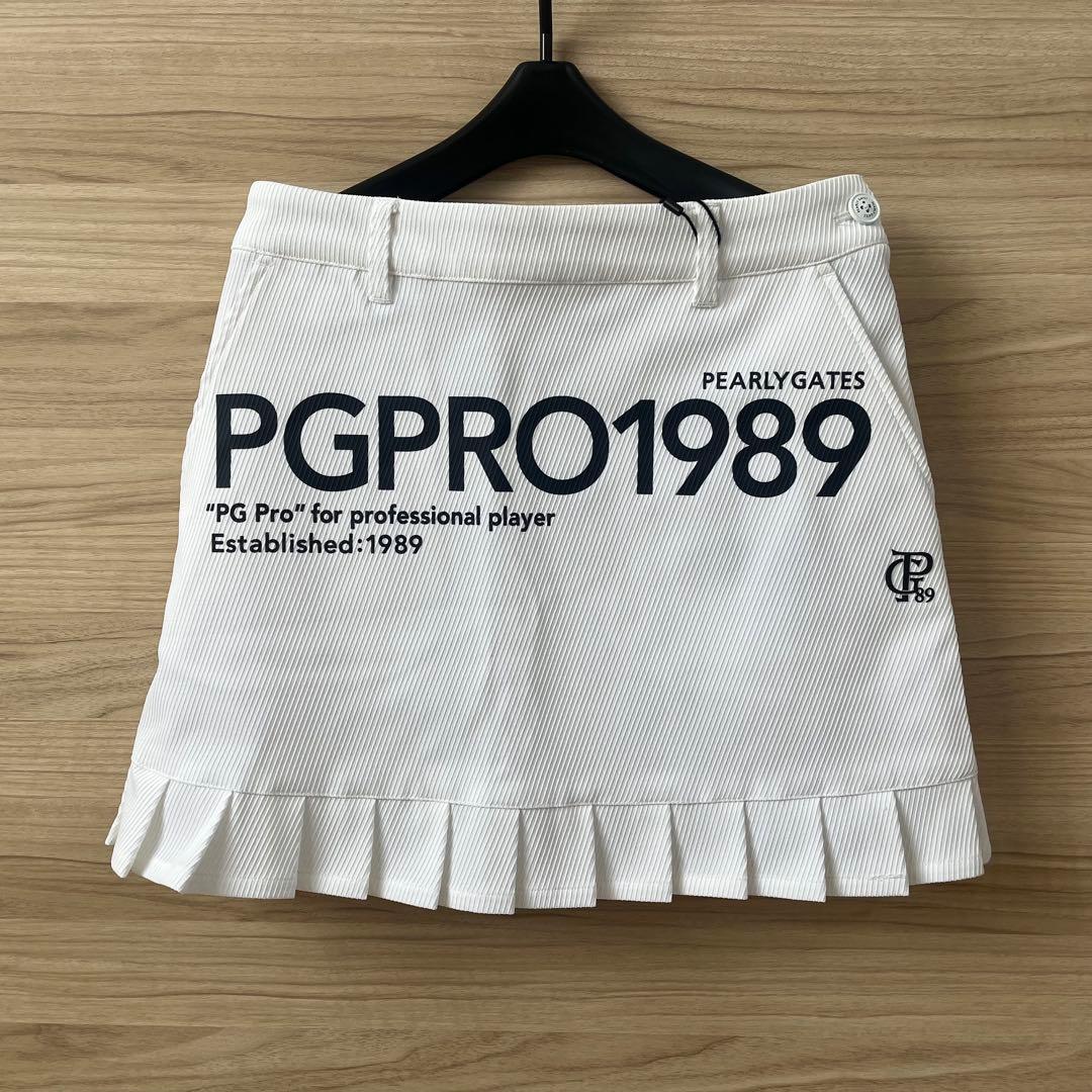 新品★28,600円 パーリーゲイツ 春夏ゴルフスカート 裾プリーズ 濃紺×白０