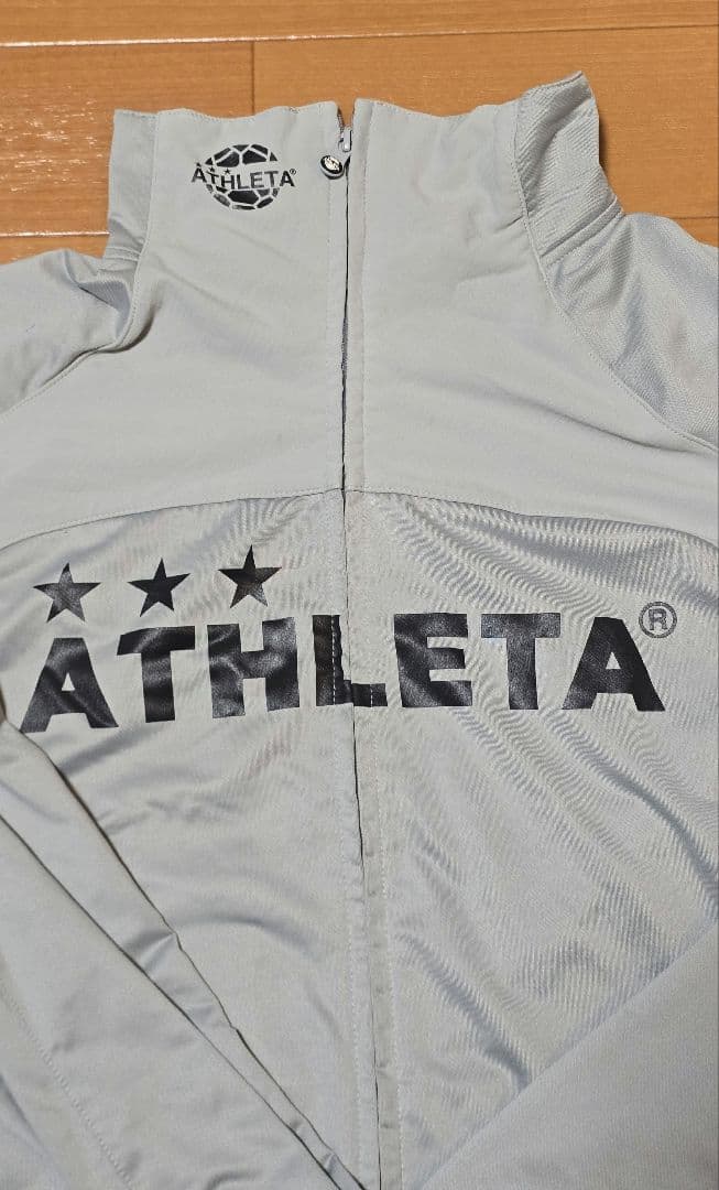 ATHLETA ピステ・ウィンドブレーカー グレー
