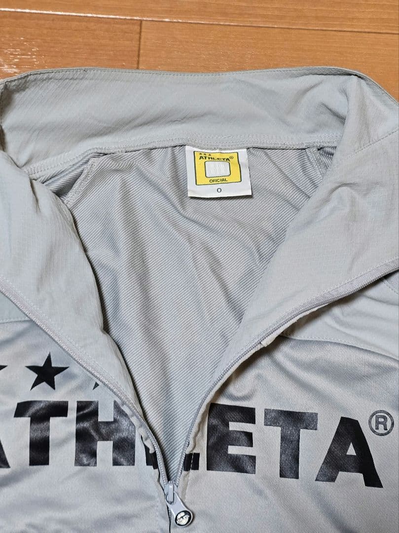 ATHLETA ピステ・ウィンドブレーカー グレー