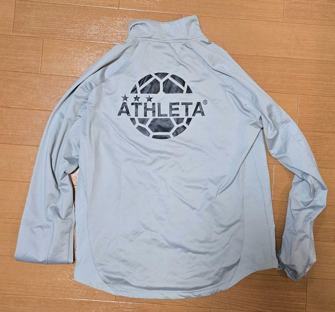ATHLETA ピステ・ウィンドブレーカー グレー