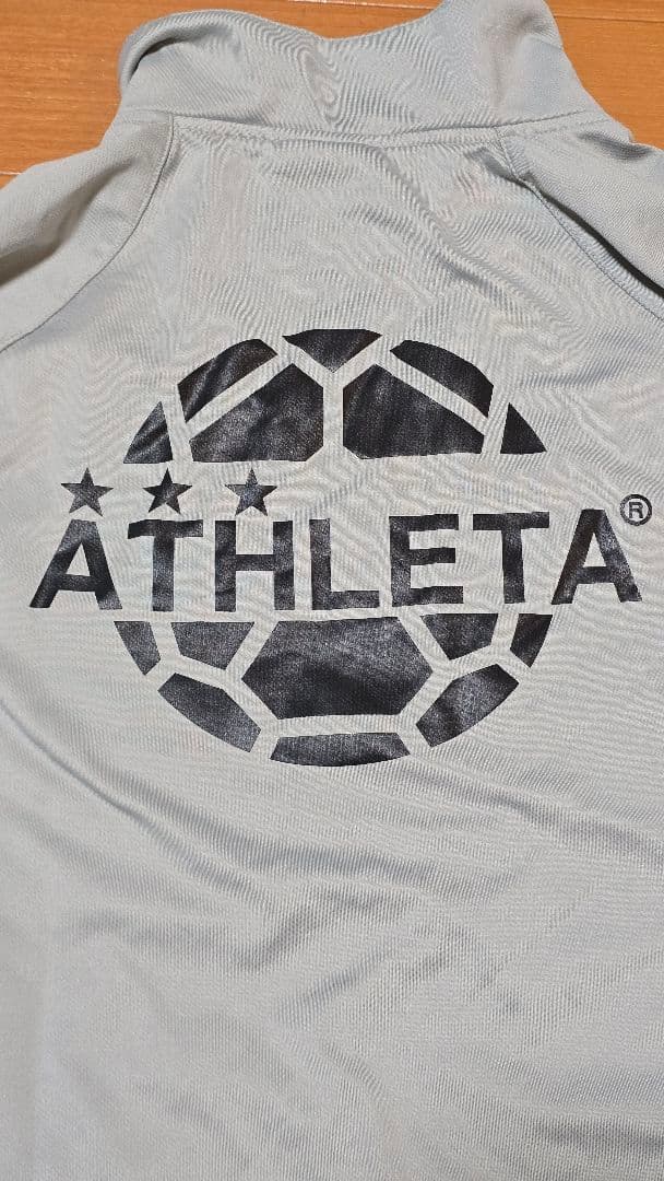 ATHLETA ピステ・ウィンドブレーカー グレー