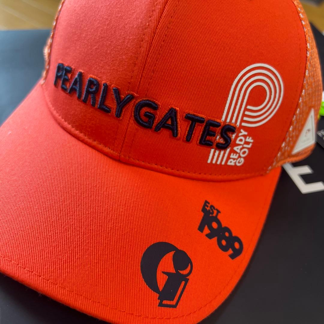 PEARLY GATES オレンジゴルフキャップ　左側面4 つのロゴマークあ入り