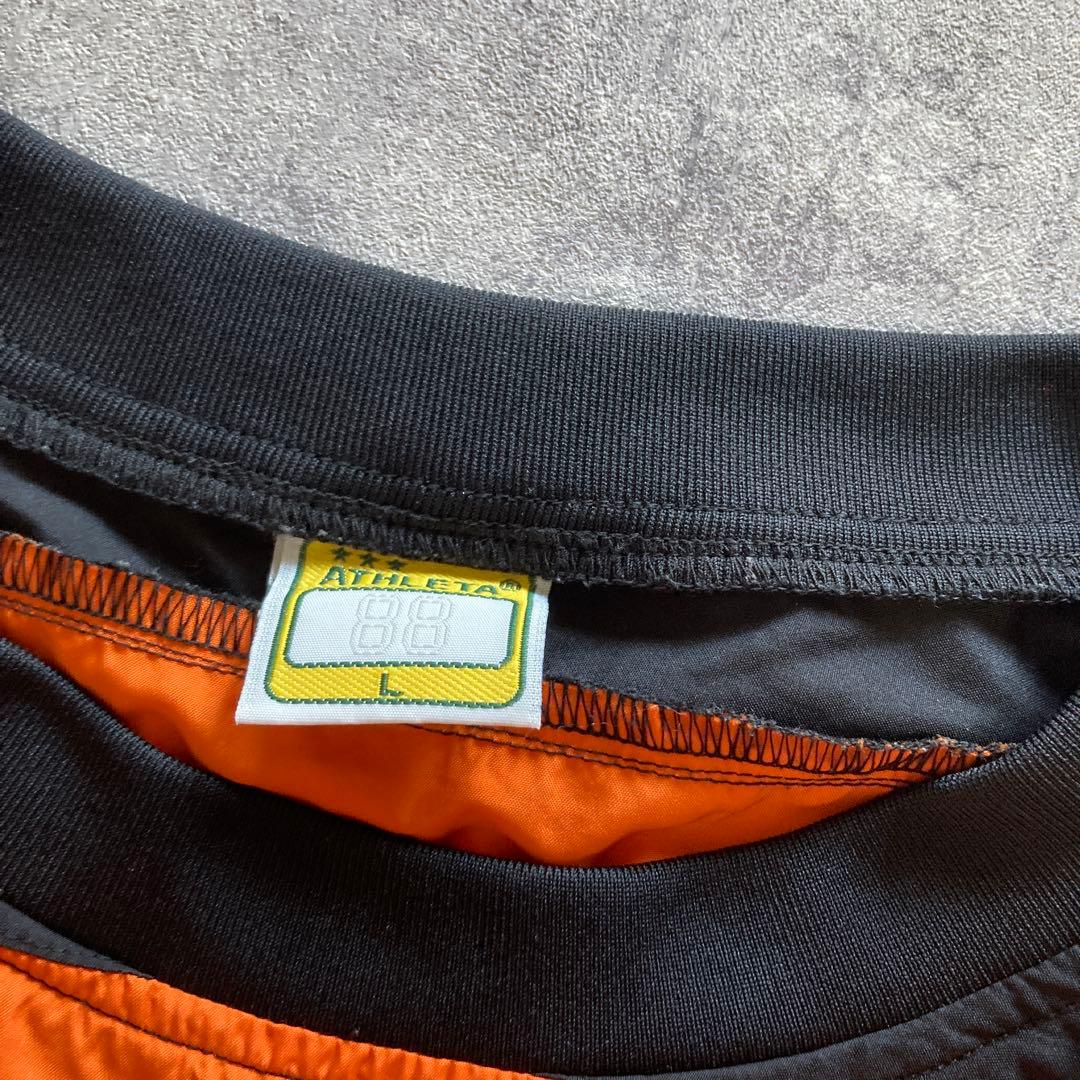 ATHLETA ピステ上下 セットアップ　オレンジ/ブラック　Lサイズ