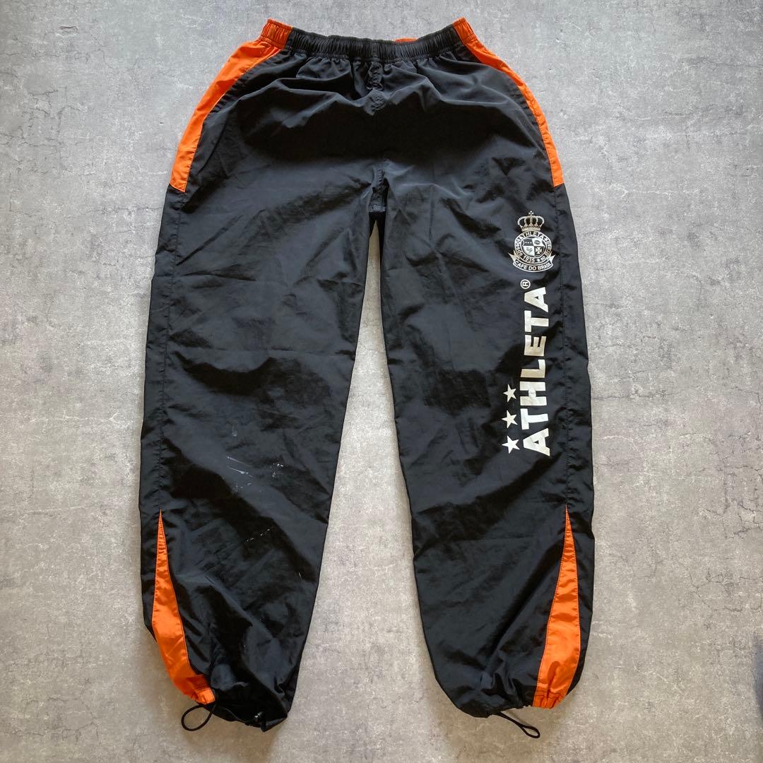 ATHLETA ピステ上下 セットアップ　オレンジ/ブラック　Lサイズ