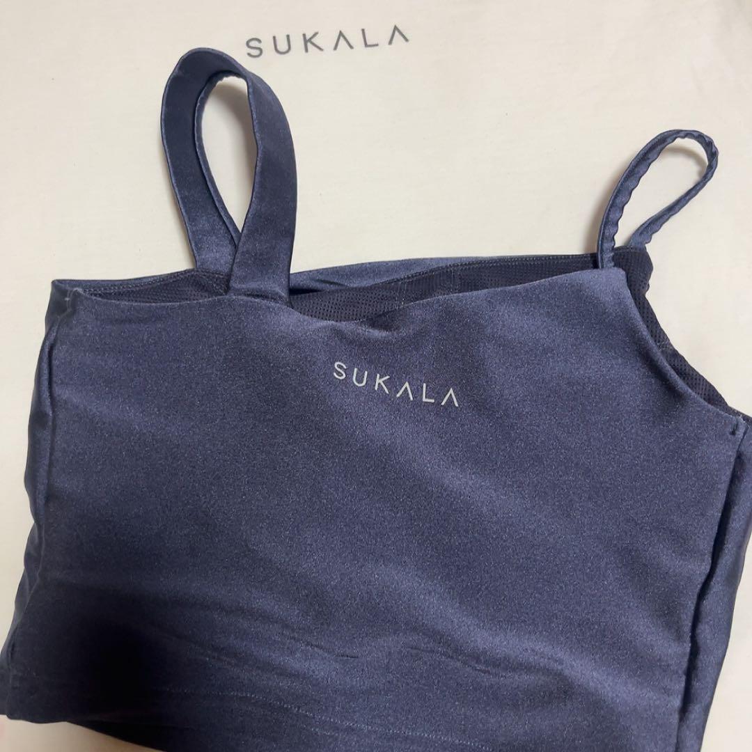 SUKALA シャインストレッチアシンメトリー トップス