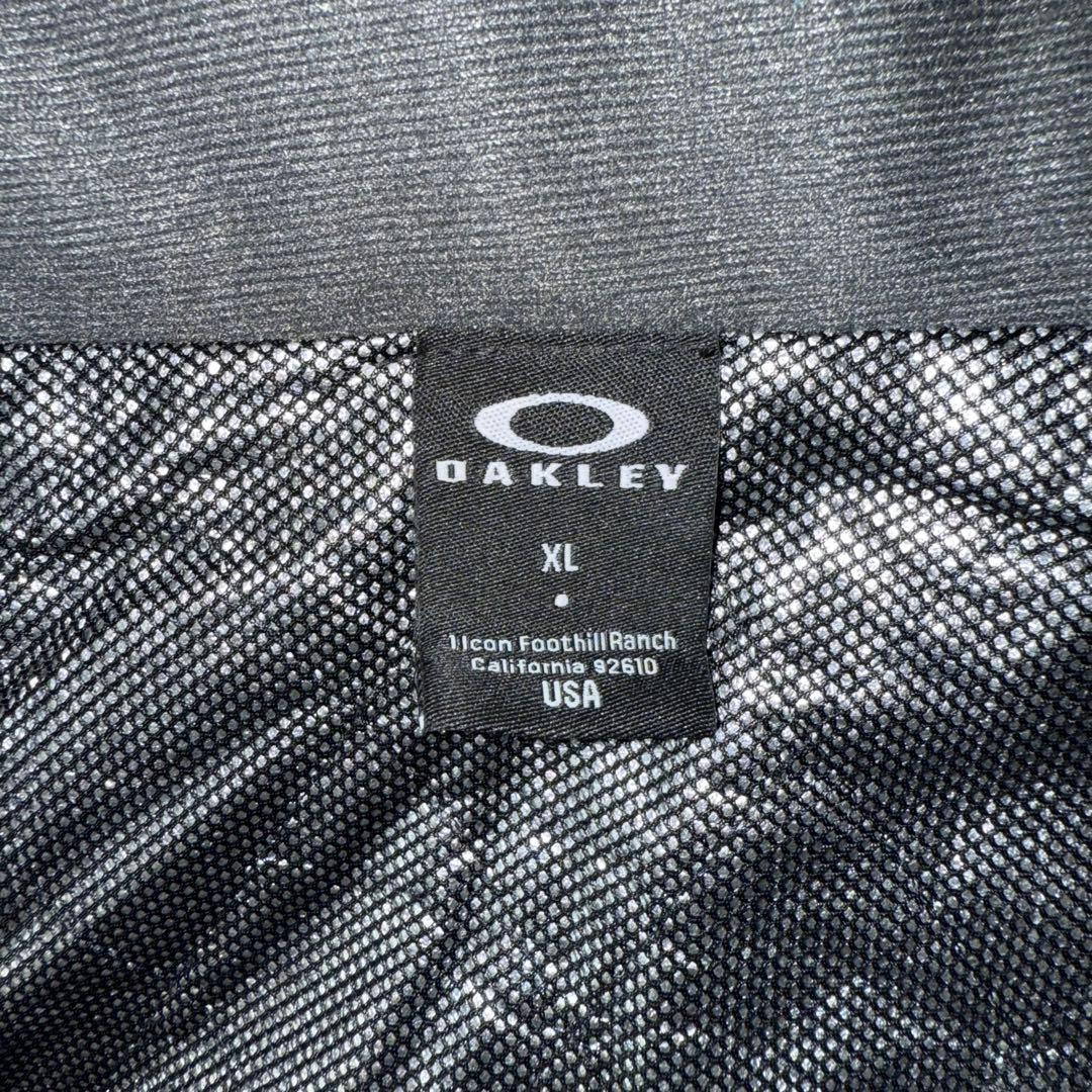 最終値下げ　美品　OAKLEY ベンチコート背面刺繍ビッグサイズ　バッグロゴ　金