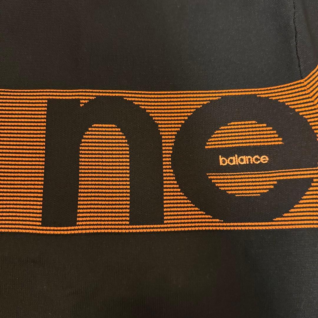 new balance ゴルフ セーター 黒/オレンジ