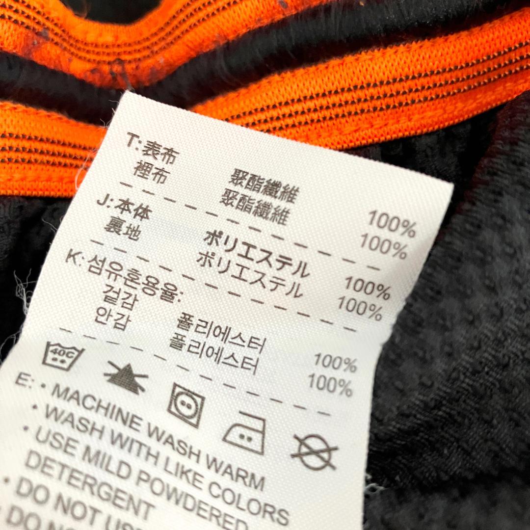 トラックパンツ　ジャージ　ブラック　オレンジ　ロゴ　プリント　ポリエステル　防寒